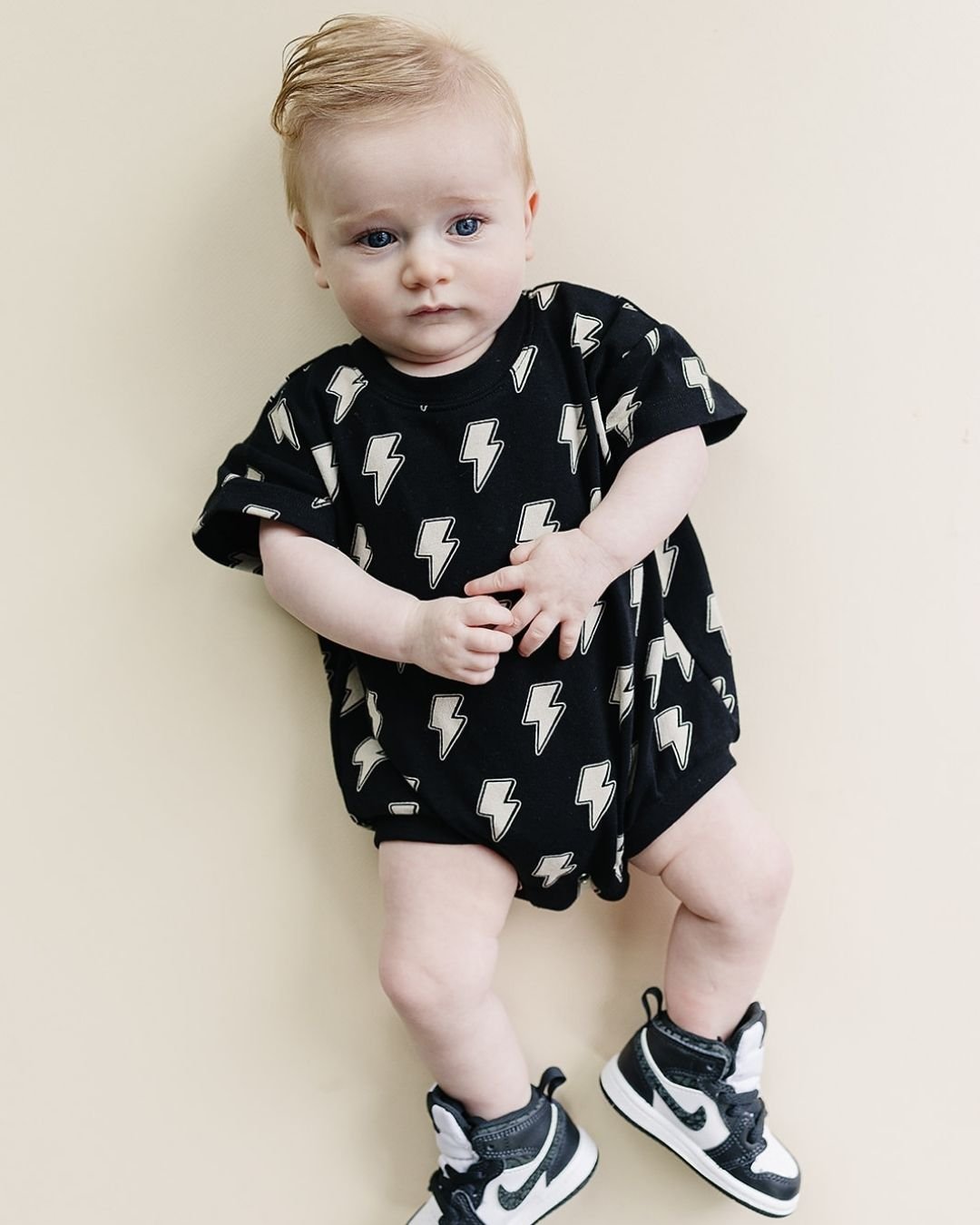 Short Sleeve Bubble Romper | Black Bolts - HoneyBug