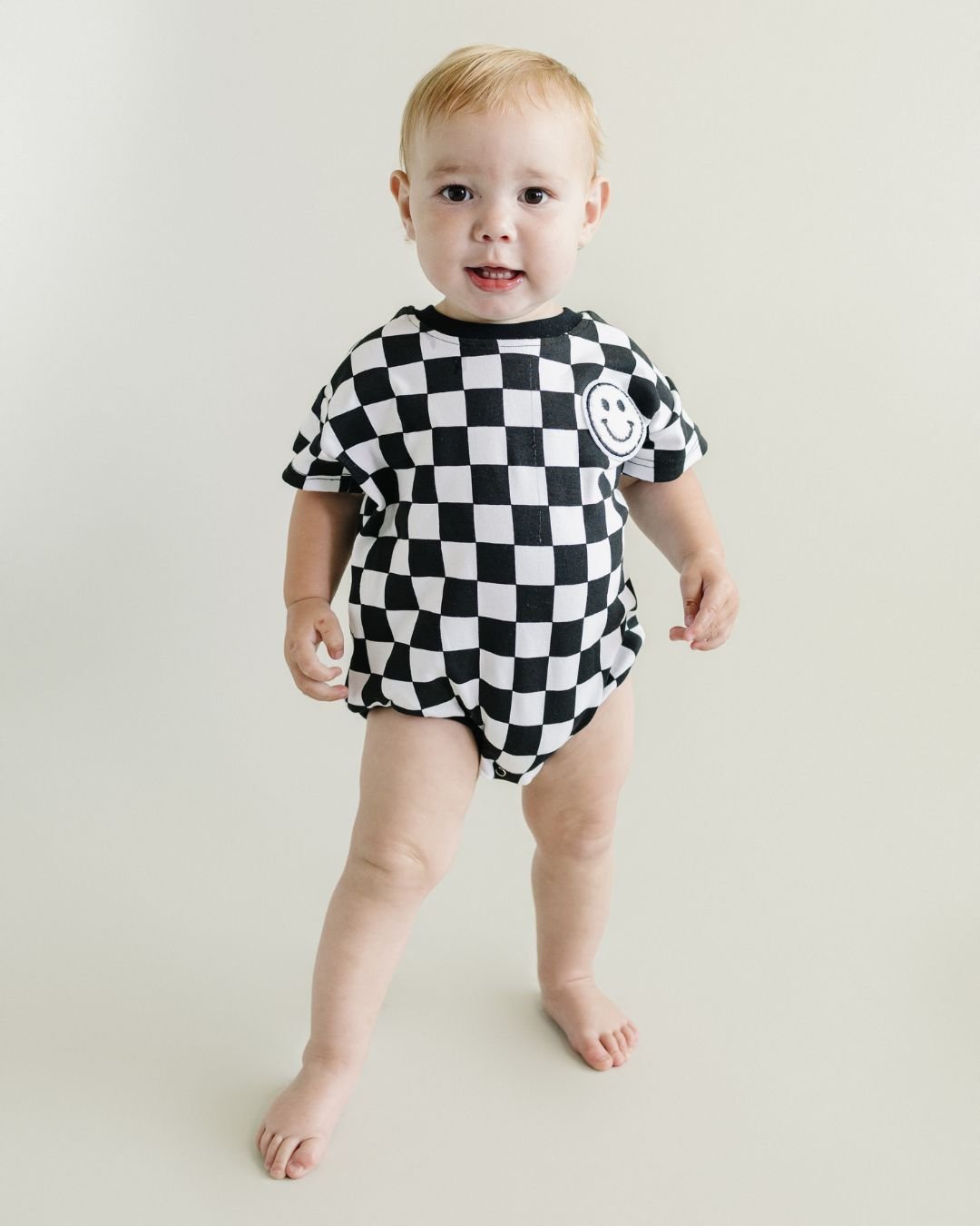 Short Sleeve Bubble Romper | Checkered Smiley Black - HoneyBug