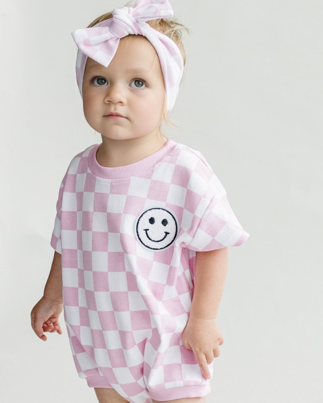 Short Sleeve Bubble Romper | Checkered Smiley Pink - HoneyBug